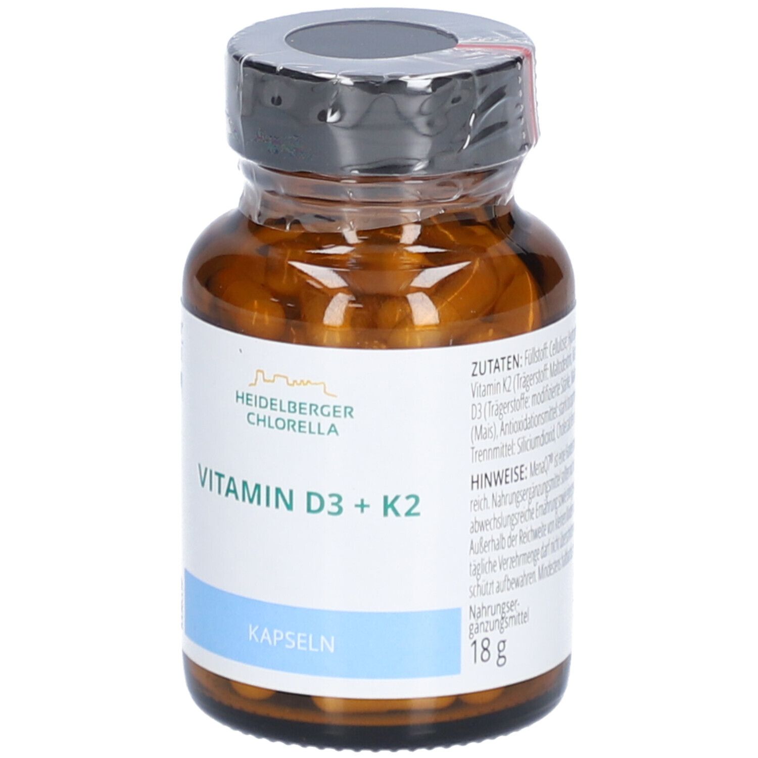 Braune Glasflasche mit Kapseln. Aufschrift: Vitamin D3 + K2, Kapseln, Heidelberger Chlorella. 18g.
