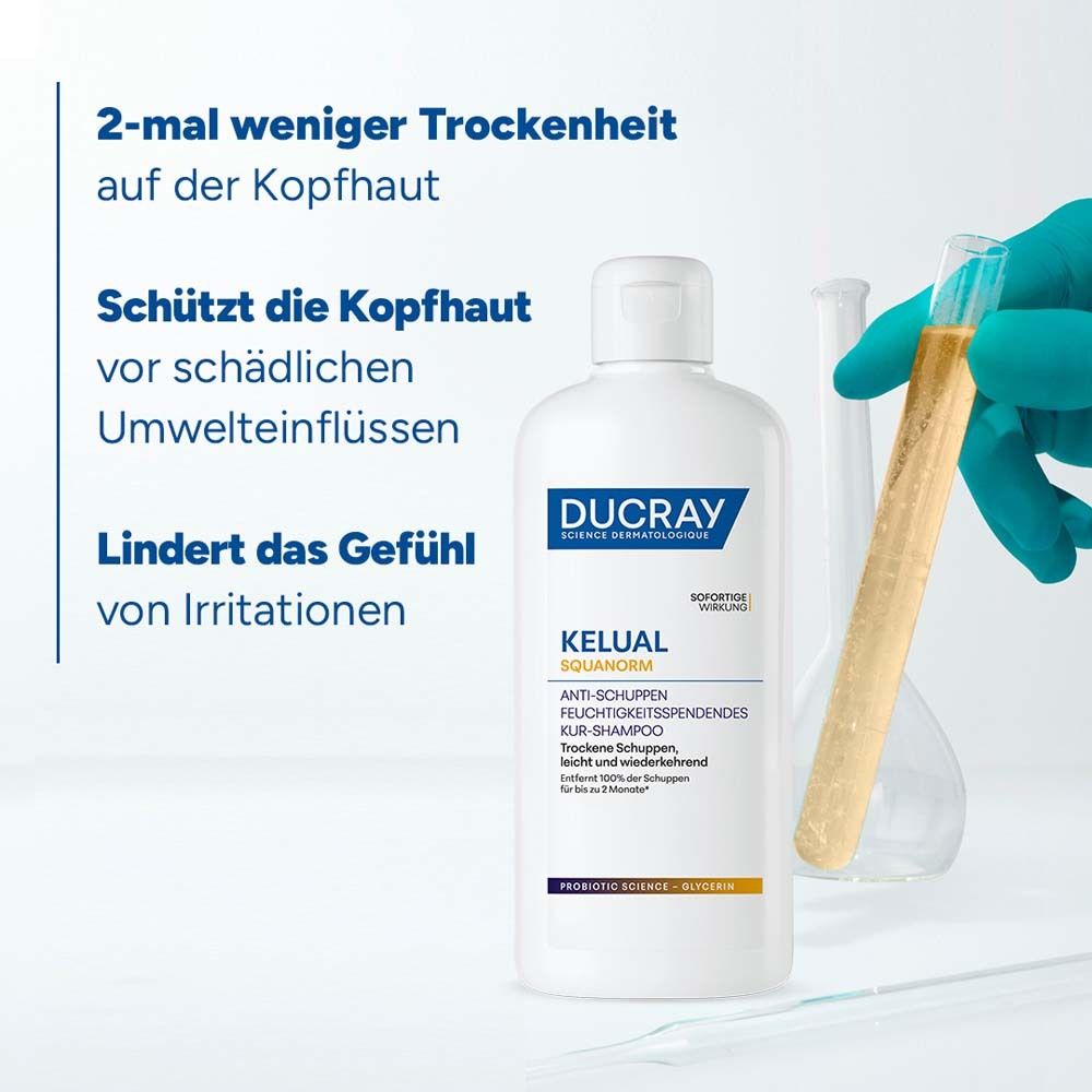 DUCRAY KELUAL Shampoo und Reagenzglas. Text: 2-mal weniger Trockenheit auf der Kopfhaut. Schützt die Kopfhaut vor schädlichen Umwelteinflüssen.
