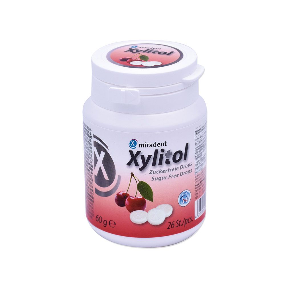 Weiße Dose mit miradent Xylitol Drops, Kirsche. Aufschrift: Zuckerfreie Drops. Kirschen und Drops abgebildet. 26 Stk/Pck.