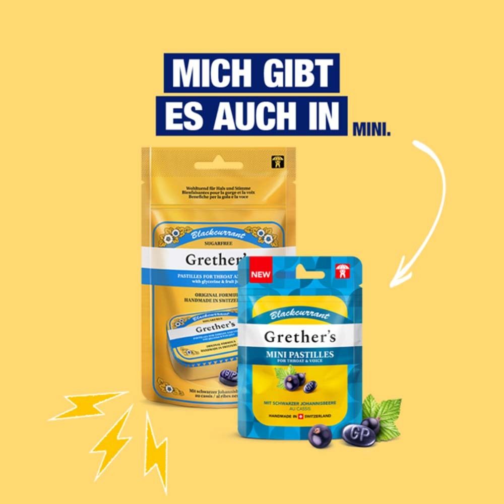 Zwei Beutel Pastillen. Aufschrift: Grether's Mini Pastillen, Schwarze Johannisbeere. Logo: Zahn mit Regenschirm. Text: Mini.
