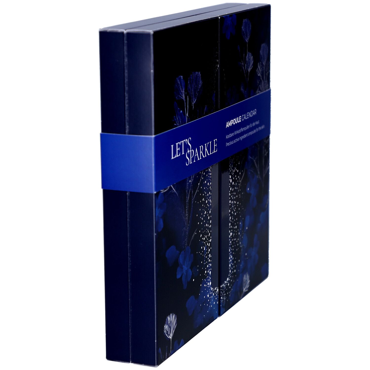 Seitenansicht der dunkelblauen Kosmetik-Adventskalender-Box mit floralem Muster und blauem Band mit "AMPOULE CALENDAR".