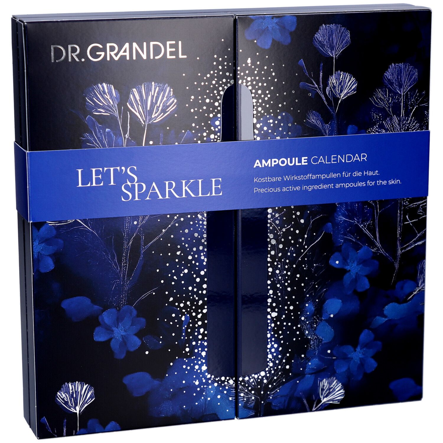 Dunkelblaue Kosmetik-Adventskalender-Box mit floralem Muster, Schriftzug "LET'S SPARKLE" und Logo "DR. GRANDEL". Blaue Band.