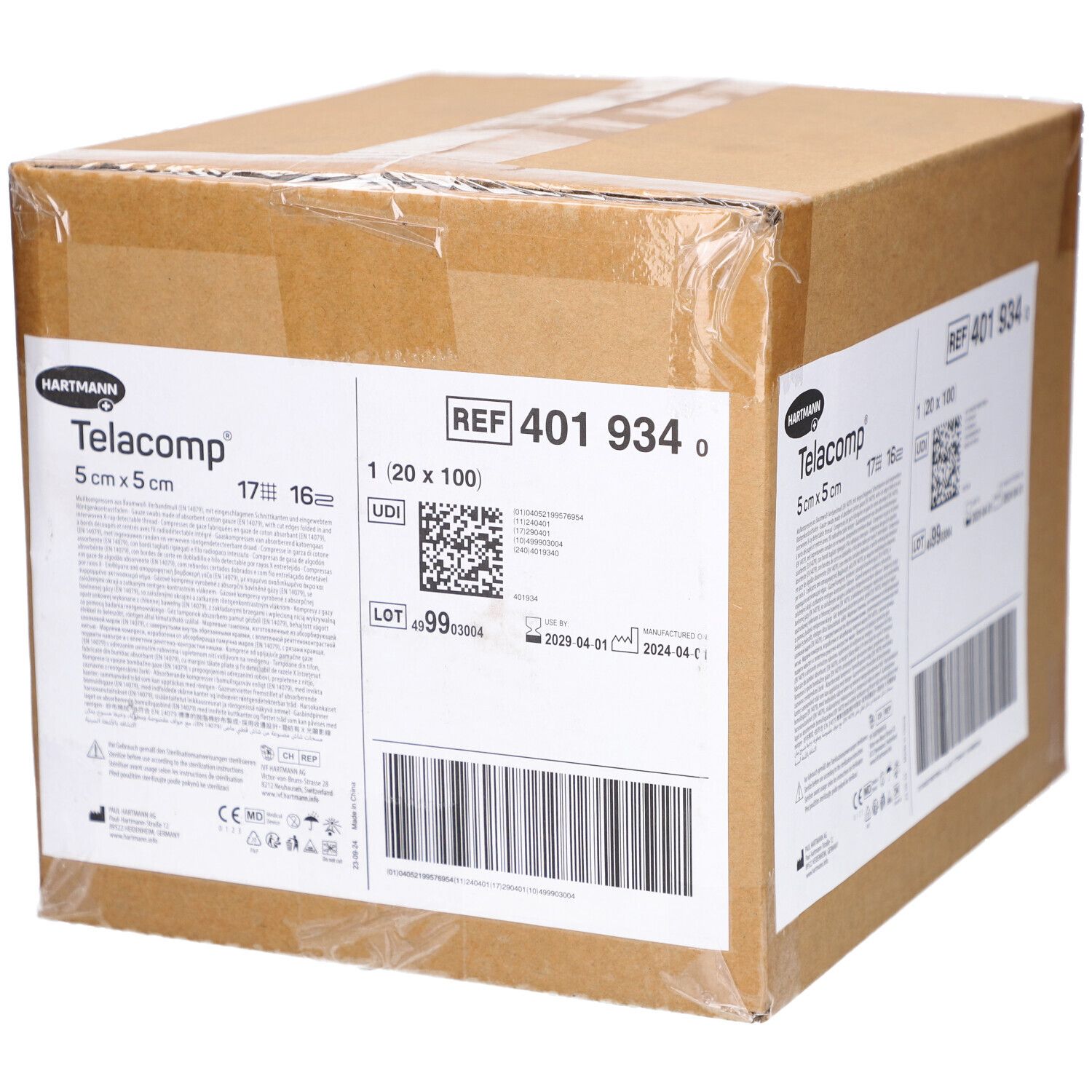 Karton mit Telacomp-Verbandmull. Aufschrift: 5 cm x 5 cm. Enthält Informationen wie REF 401 934, Chargennummer und Verfallsdatum.