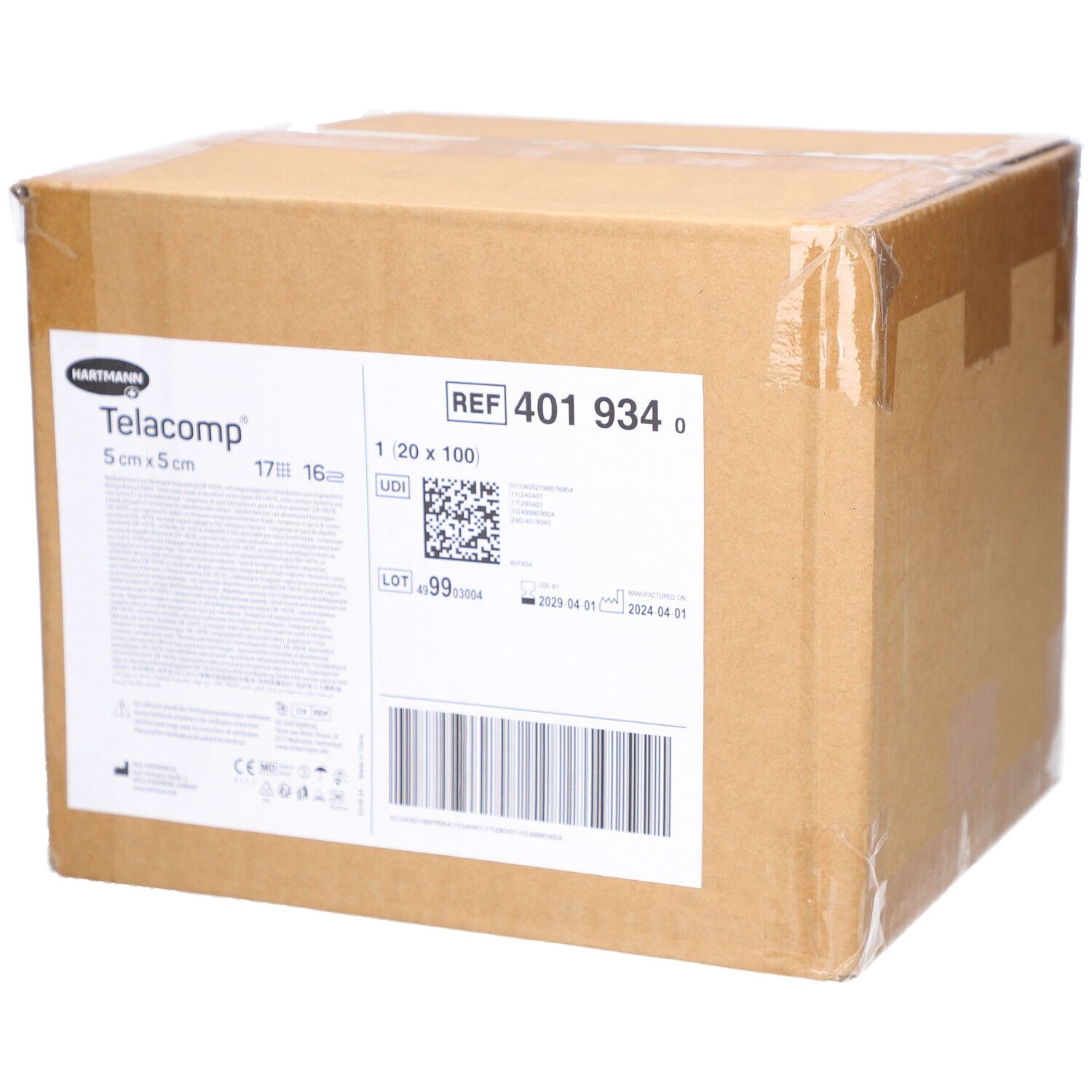 Karton mit Telacomp-Verbandmull. Aufschrift: 5 cm x 5 cm. Enthält Informationen wie REF 401 934, Chargennummer und Verfallsdatum.