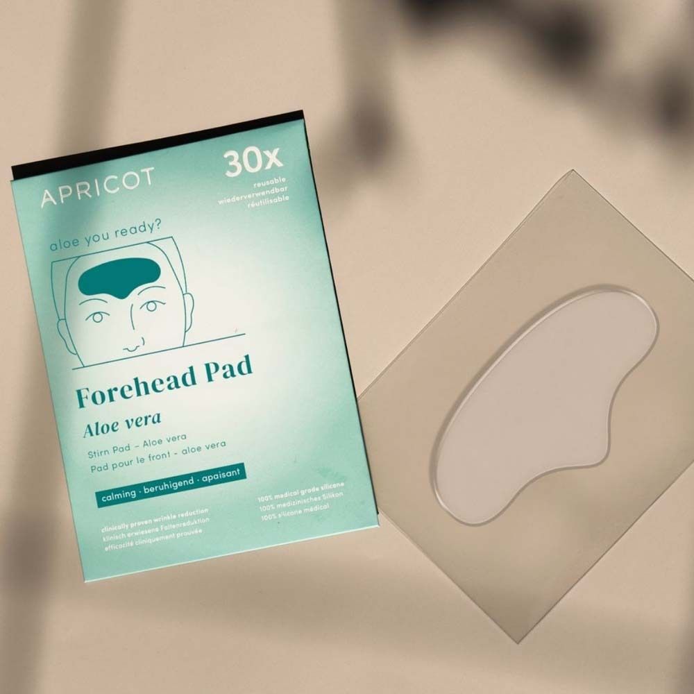 Verpackung und Stirn Pad. Marke APRICOT. Text: Forehead Pad Aloe vera. 30x. Wiederverwendbar.