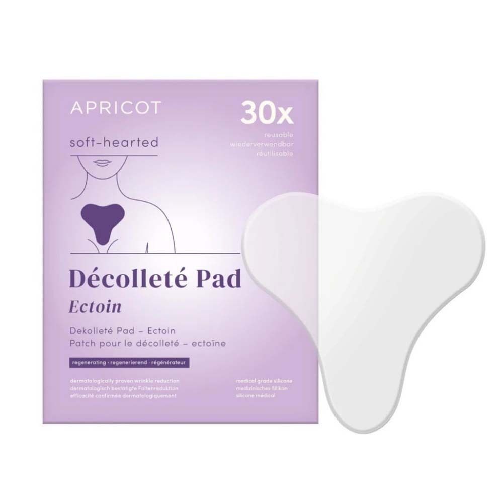 Verpackung mit APRICOT Décolleté Pad. Aufdruck: 30x, Ectoin. Weisses Dekolleté Pad daneben.