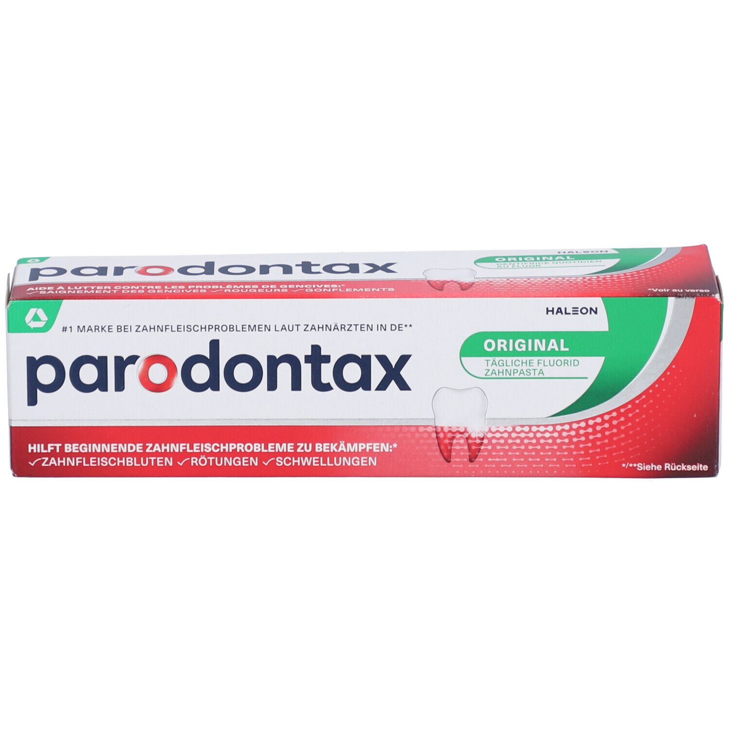 Zahnpasta-Verpackung mit rotem und grünem Design. Der Markenname und Produktbezeichnung sind sichtbar.