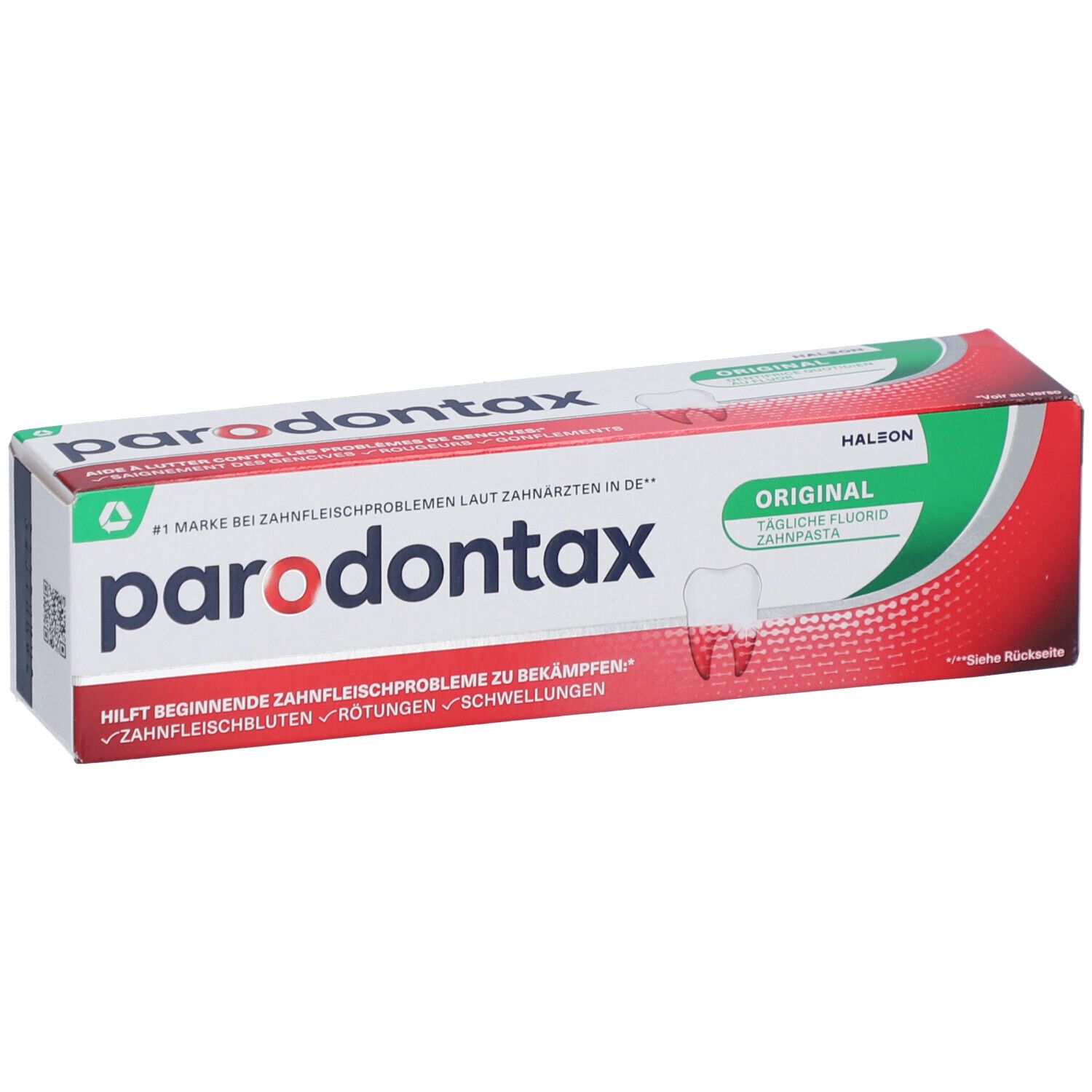 Zahnpasta-Verpackung mit rotem und grünem Design. Der Markenname und Produktbezeichnung sind sichtbar.