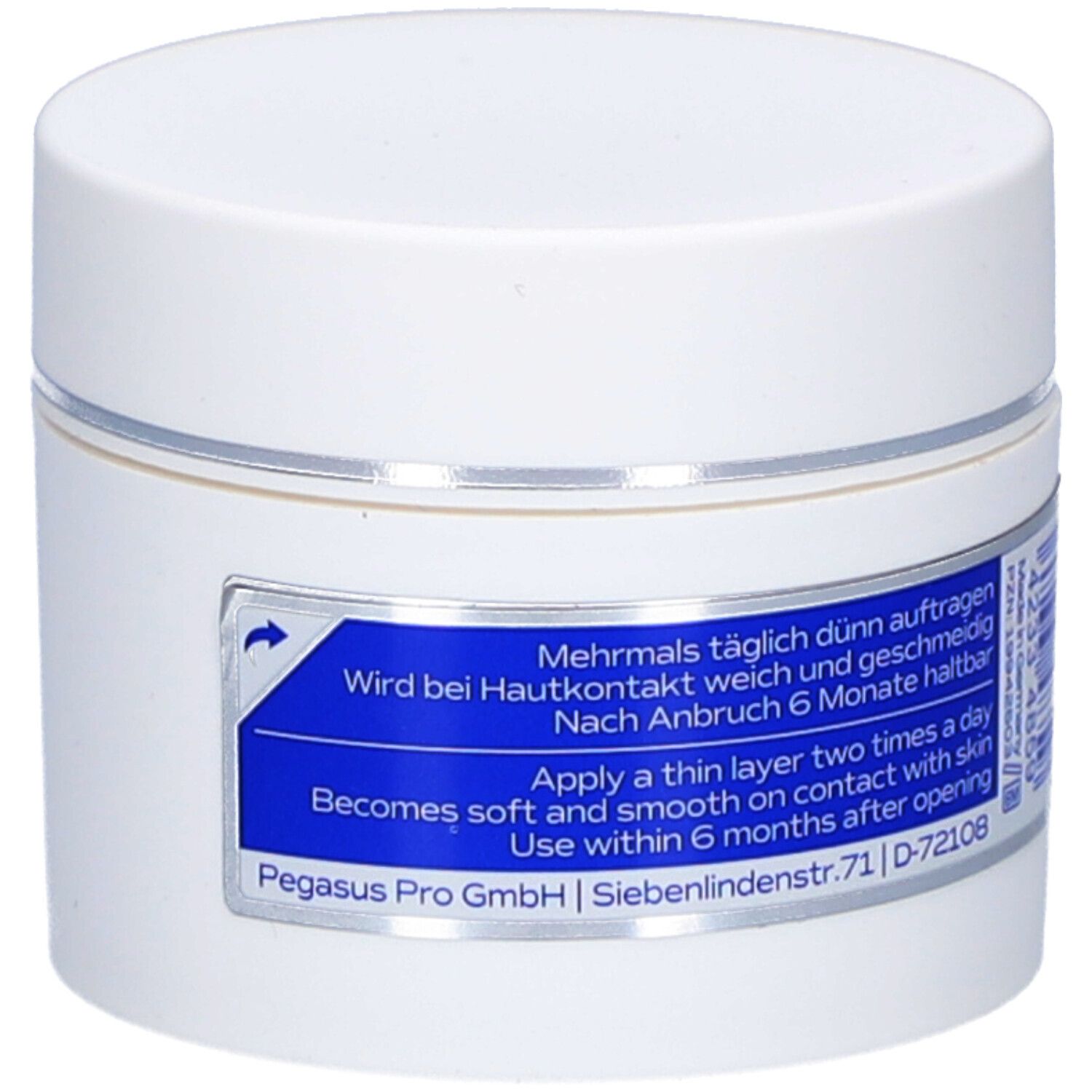 Weiße Dose mit blauem Etikett. Beschriftung: Tattoo-Butter, Dermatologisch getestet, Vegan, mit Sheabutter, Hautberuhigend, 30ml.