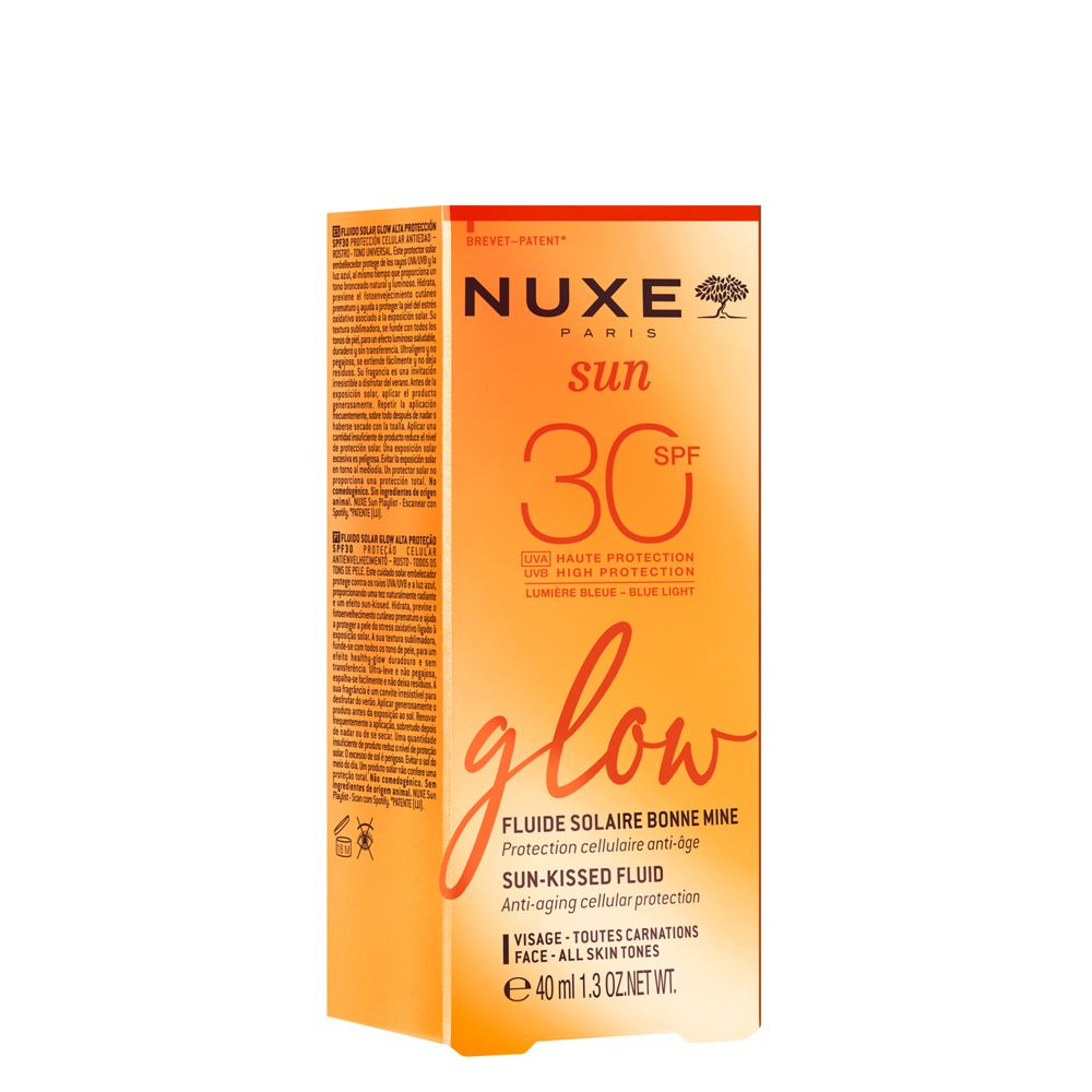 NUXE Sun Sonnenfluid Glow LSF 30. Orangefarbene Verpackung. Text: SPF 30, glow, Fluide Solaire Bonne Mine.