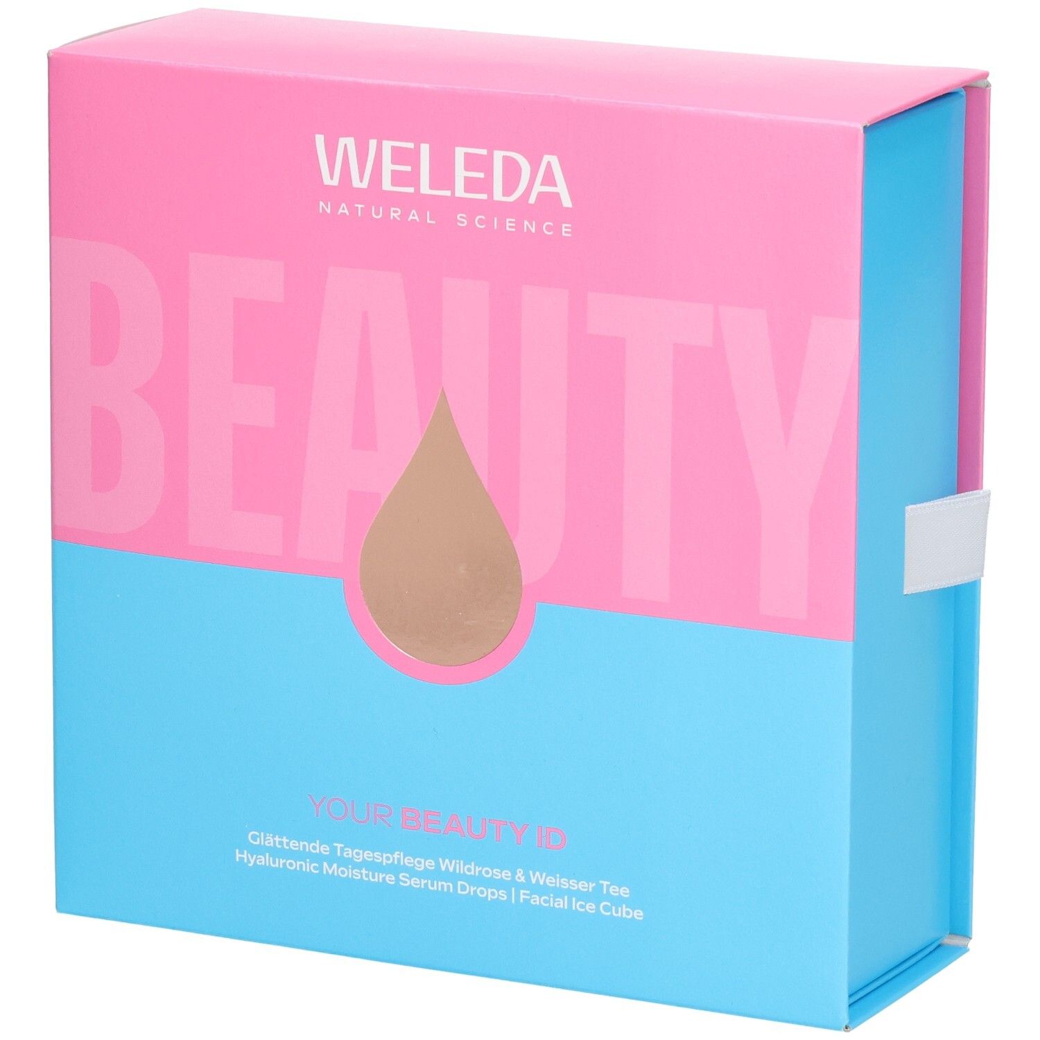 Geschenkset-Box, zweifarbig: Pink und Blau. Aufschrift: WELEDA, BEAUTY. Tropfen-Symbol. Text: YOUR BEAUTY ID, Tagespflege, Serum Drops.