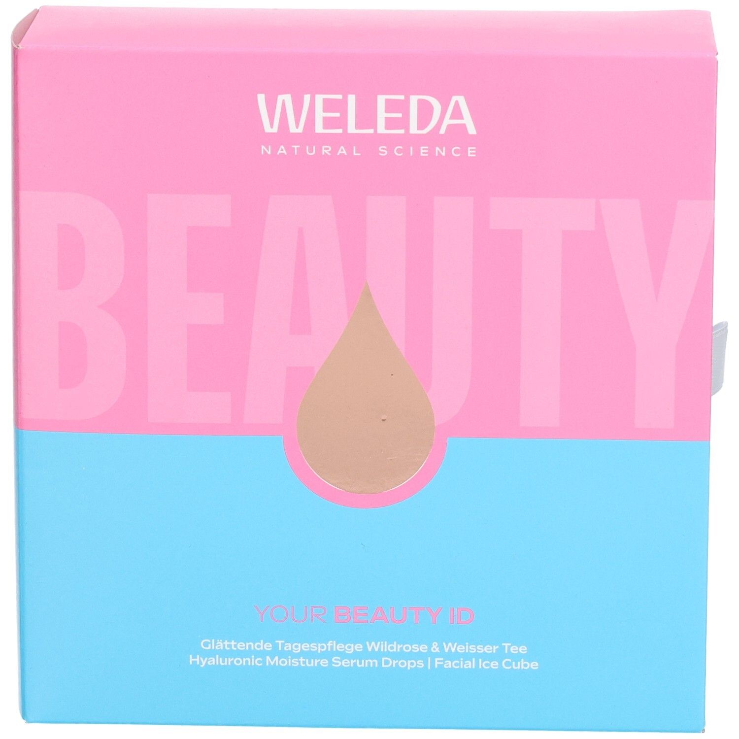 Geschenkset-Box, zweifarbig: Pink und Blau. Aufschrift: WELEDA, BEAUTY. Tropfen-Symbol. Text: YOUR BEAUTY ID, Tagespflege, Serum Drops.