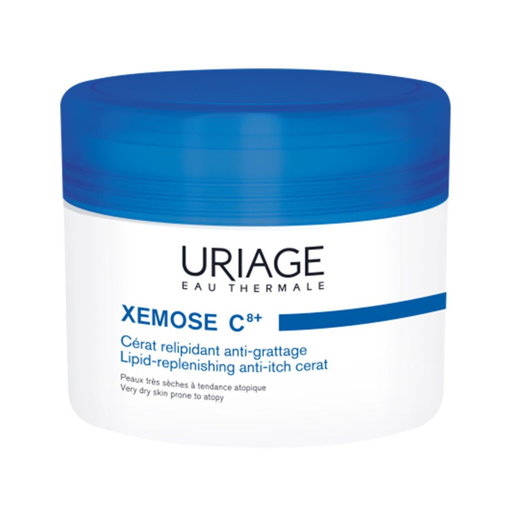 Weißes Tiegel mit blauem Deckel. Uriage Xémose C8+ Cérat, Lipid-replenishing anti-itch cerat.