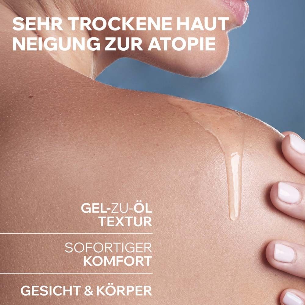 Nahaufnahme einer Schulter mit fließendem Öl. Text: Gel-zu-Öl Textur, sofortiger Komfort, Gesicht & Körper.