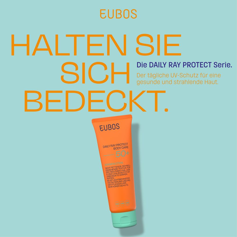 EUBOS Daily Ray Protect Body Care LSF 50+ Tube. Text auf blauem Hintergrund. Orange Tube.
