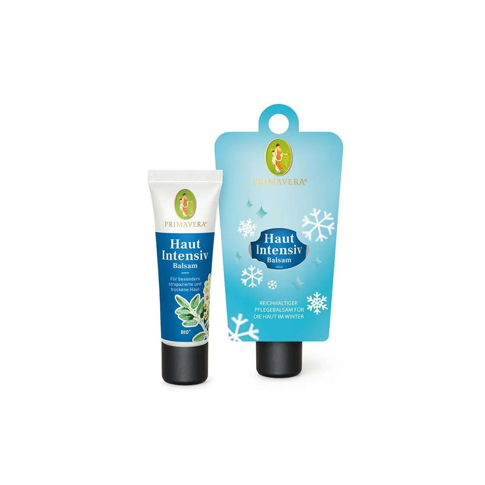 Zwei Primavera Haut Intensiv Balsam Tuben in verschiedenen Größen. Blaue Etiketten mit Schneeflocken.