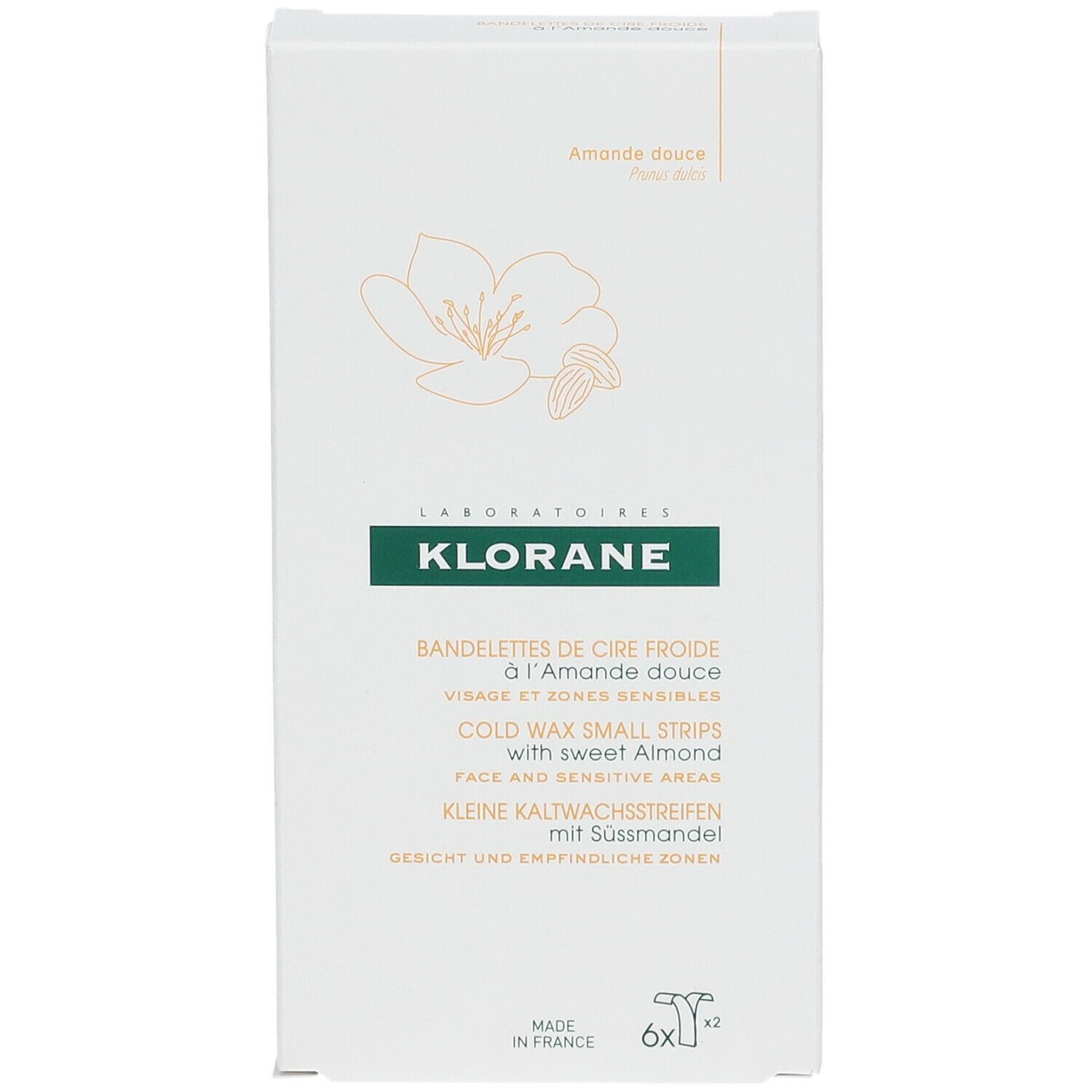 Klorane-Verpackung mit Kaltwachsstreifen für das Gesicht. Aufschrift: Klorane, Mandel, Gesicht, empfindliche Bereiche. 6x2 Streifen.