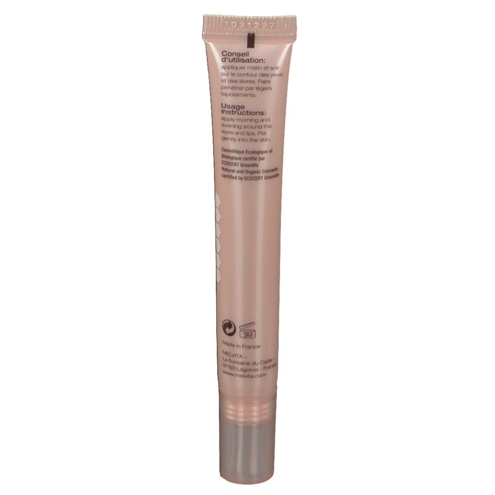 Rückseite des Creme-Tubes. Text: Conseil d'utilisation, Usage Instructions. Beige Tube mit silberner Kappe. Logo und Informationen.