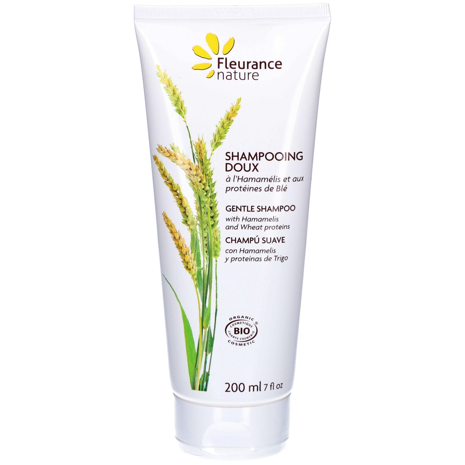 Weißes Shampoo-Tube mit gelbem Blütenlogo. Text: "Shampooing Doux" und "Gentle Shampoo". Bio-Zertifizierung.