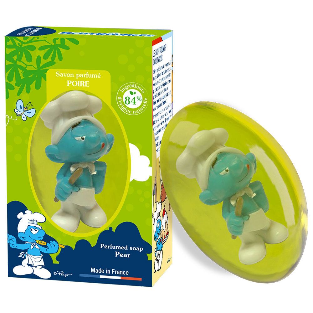 Ovales Seifenstück mit blauem Koch-Schlumpf. Grüne Verpackung mit Schlumpf-Motiv und Birnen-Duft-Hinweis.