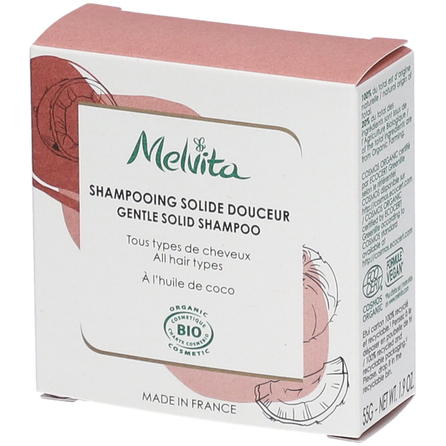 Kartonverpackung mit Melvita Shampoo. Text: "Shampooing solide douceur", "BIO COSMETIC". Kokosnuss-Illustration.