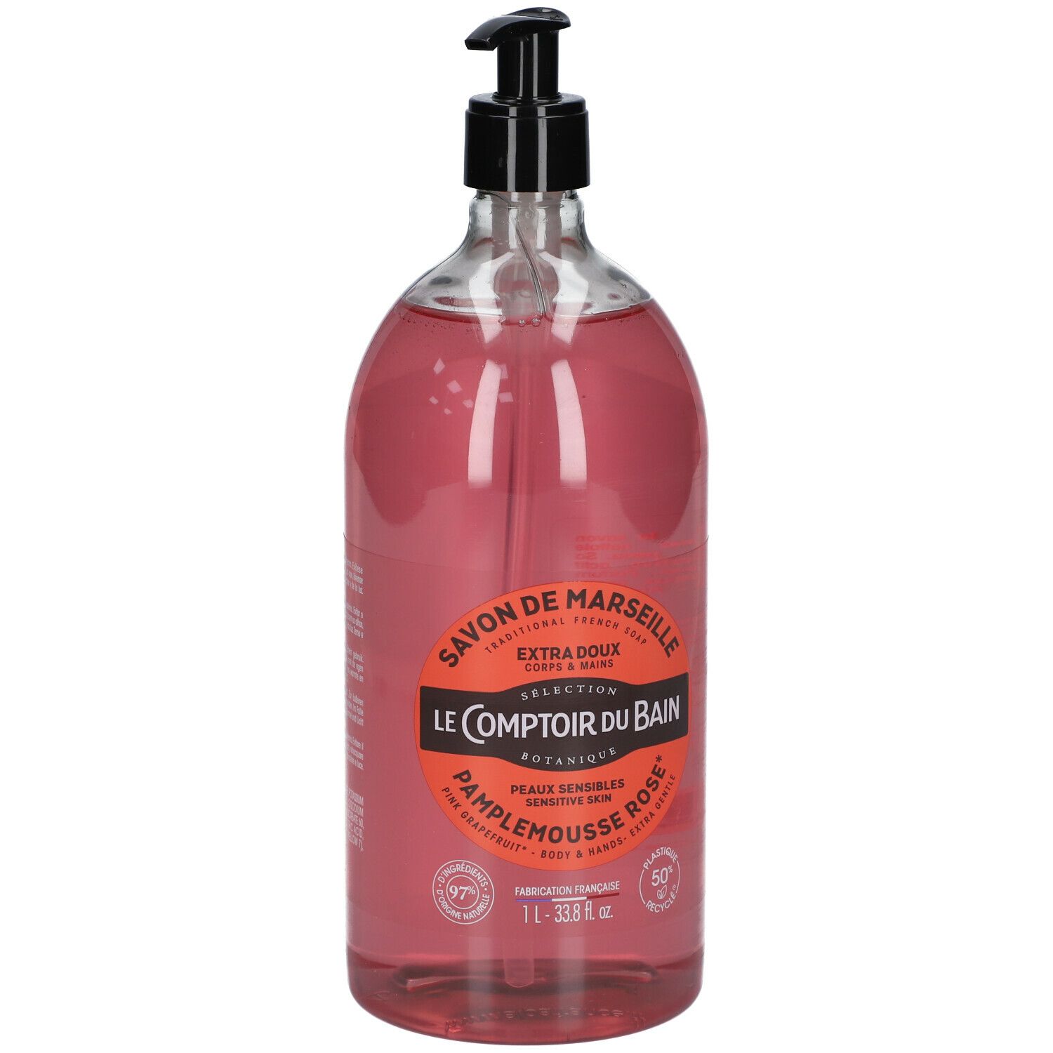 Transparente Flasche mit rosa Flüssigseife und schwarzem Pumpspender. Etikett mit Produktinformationen.