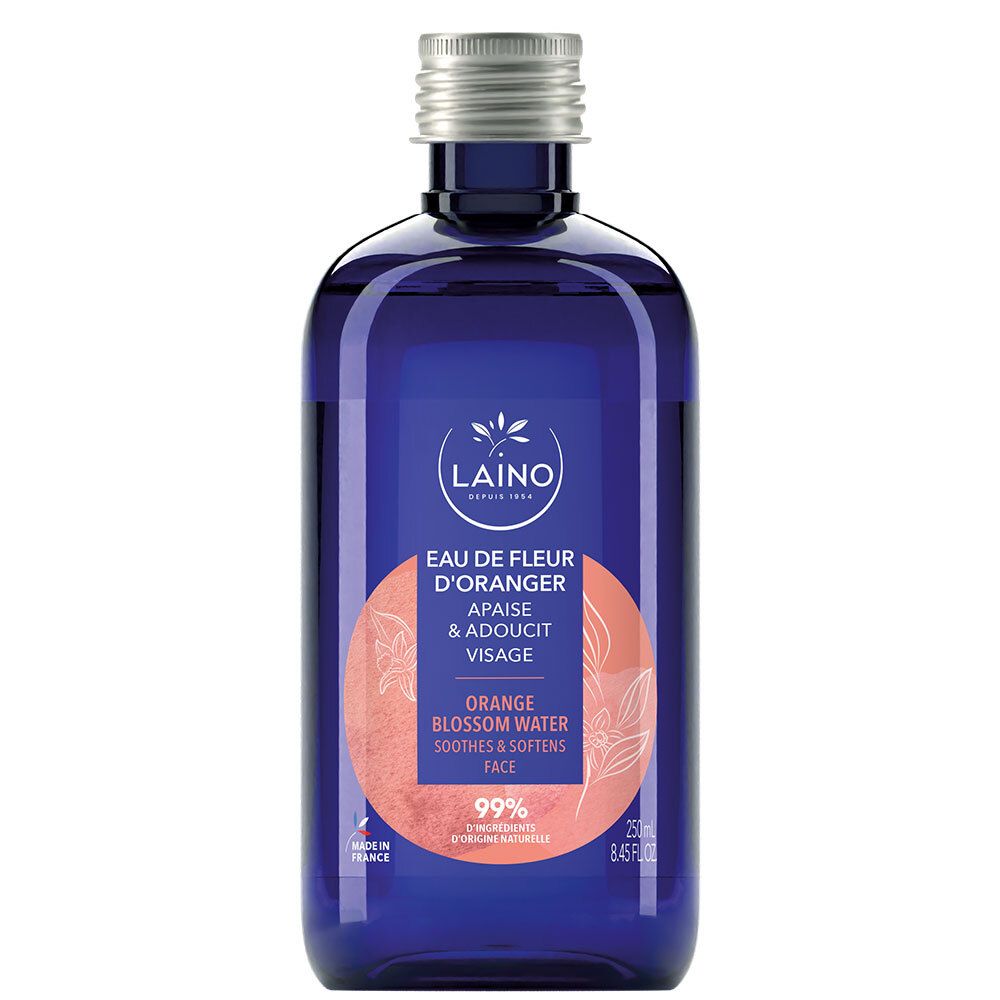 Blaue Glasflasche mit silbernem Deckel. LAINO Orangenblütenwasser. Text: Eau de Fleur d'Oranger, 99% Inhaltsstoffe natürlichen Ursprungs.