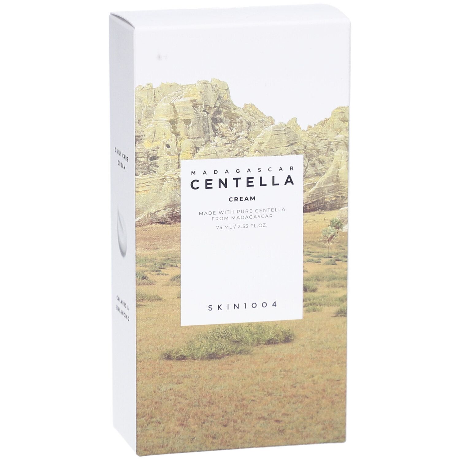 Vorderseite der SKIN1004 MADAGASCAR CENTELLA CREAM Verpackung. Produktname und Landschaftsbild.