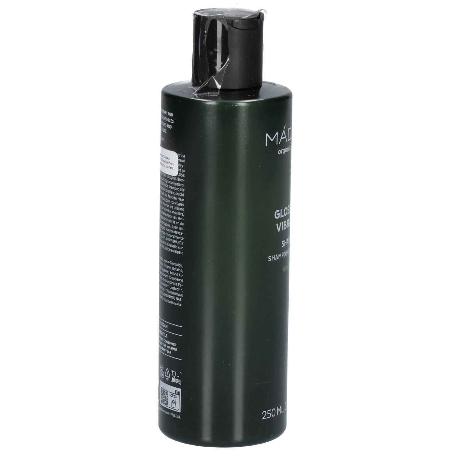 Rückseite einer grünen Shampoo-Flasche. Beschriftung enthält Inhaltsstoffe und Anwendungshinweise.