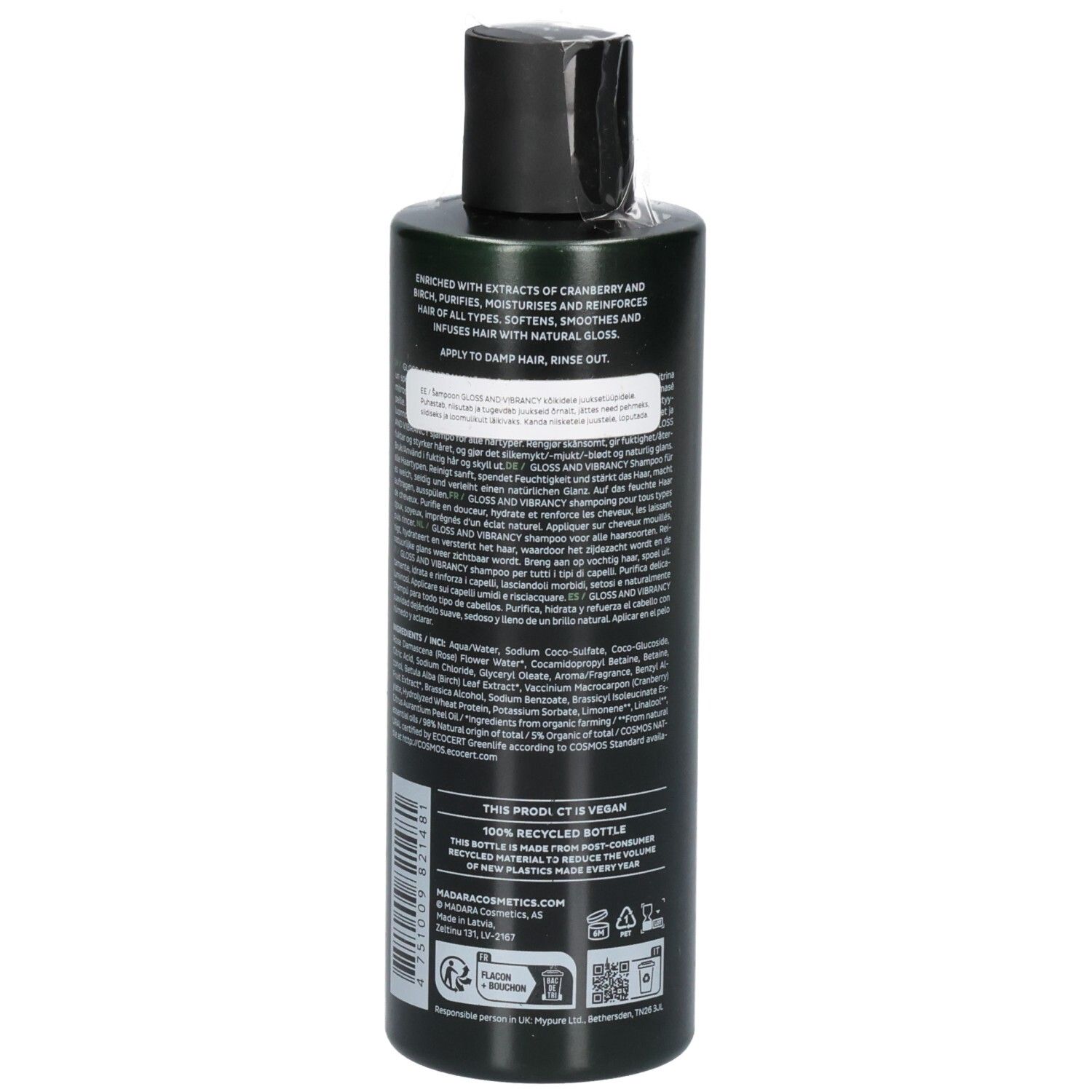 Rückseite einer grünen Shampoo-Flasche. Beschriftung enthält Inhaltsstoffe, Anwendungshinweise und Siegel.