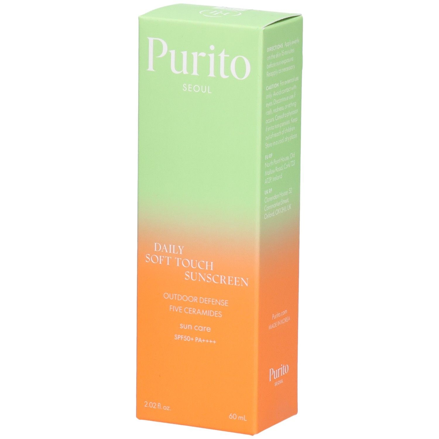 Grüne und orangefarbene Schachtel mit Produktinformationen. Text: Purito, Daily Soft Touch Sunscreen, SPF 50+ PA++++.