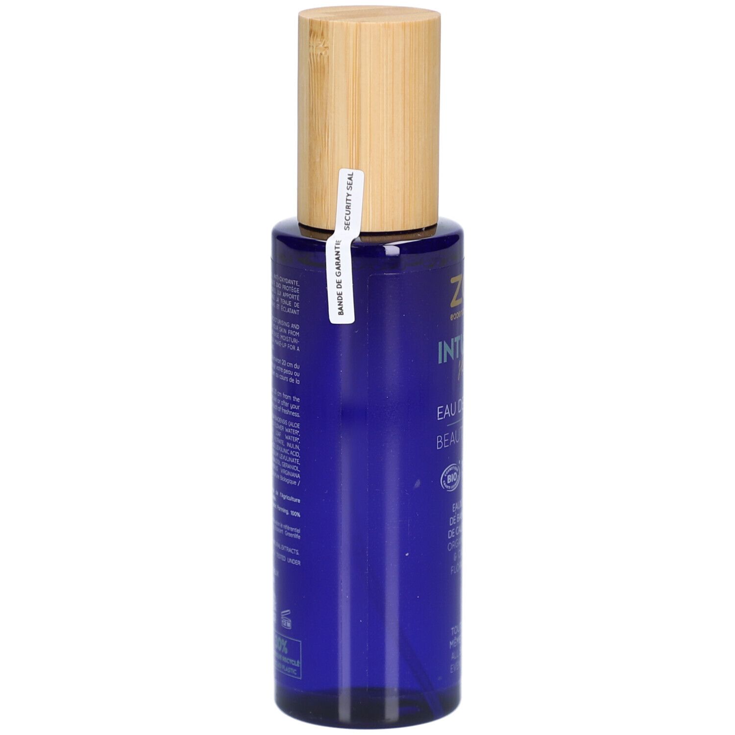 Blaue Flasche mit Holzdeckel. Sicherheitsverschluss. Aufschrift: ZAO, Intuitive Skin, Eau de Beauté, Beauty Water.