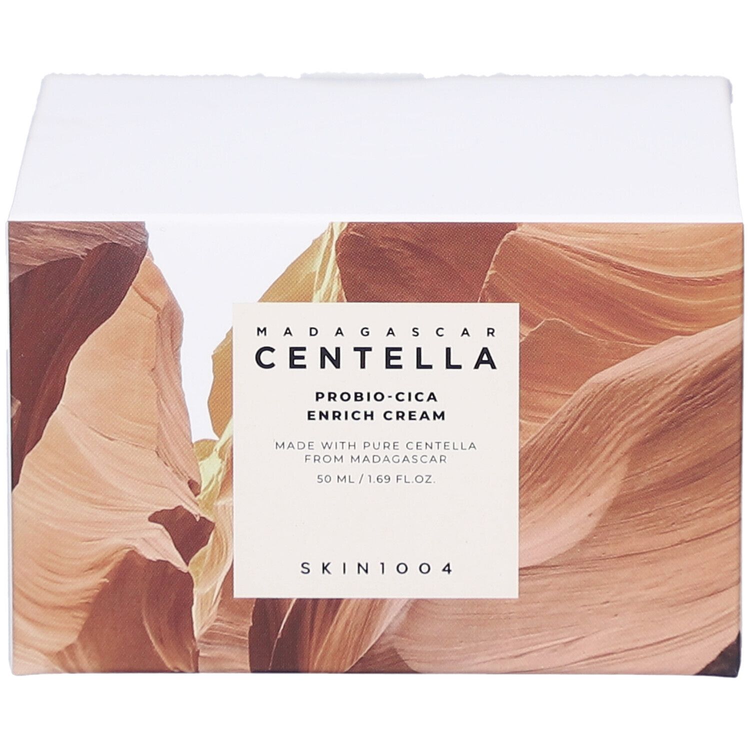 Karton mit Produktinformationen. Text: MADAGASCAR CENTELLA, PROBIO-CICA ENRICH CREAM, SKIN1004.