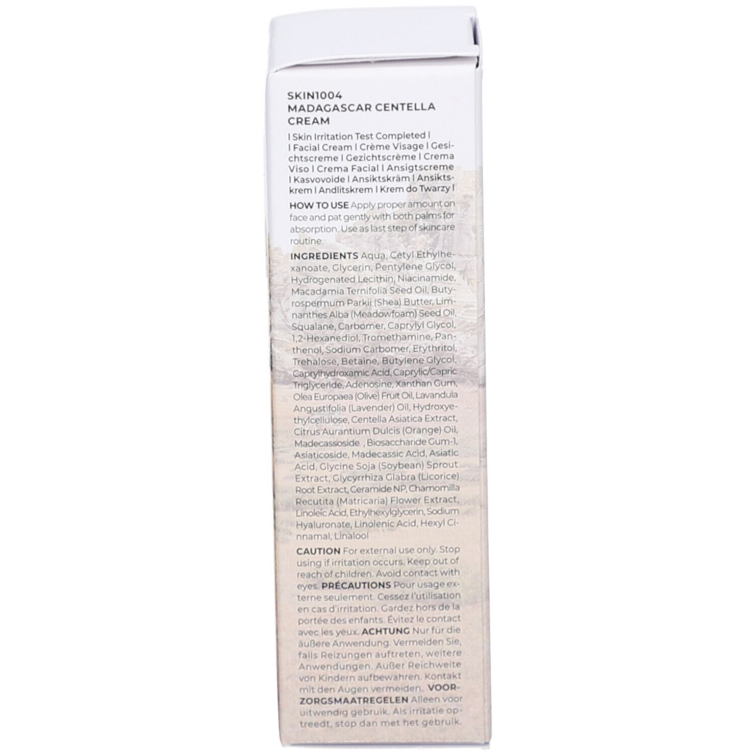 Rückseite der Verpackung. Text: SKIN1004 MADAGASCAR CENTELLA, Inhaltsstoffe, Anwendung, 30 ml.