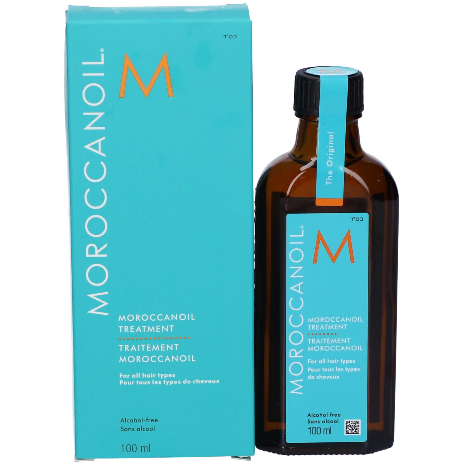 Moroccanoil Treatment Flasche und Verpackung, türkisfarben, nebeneinander.