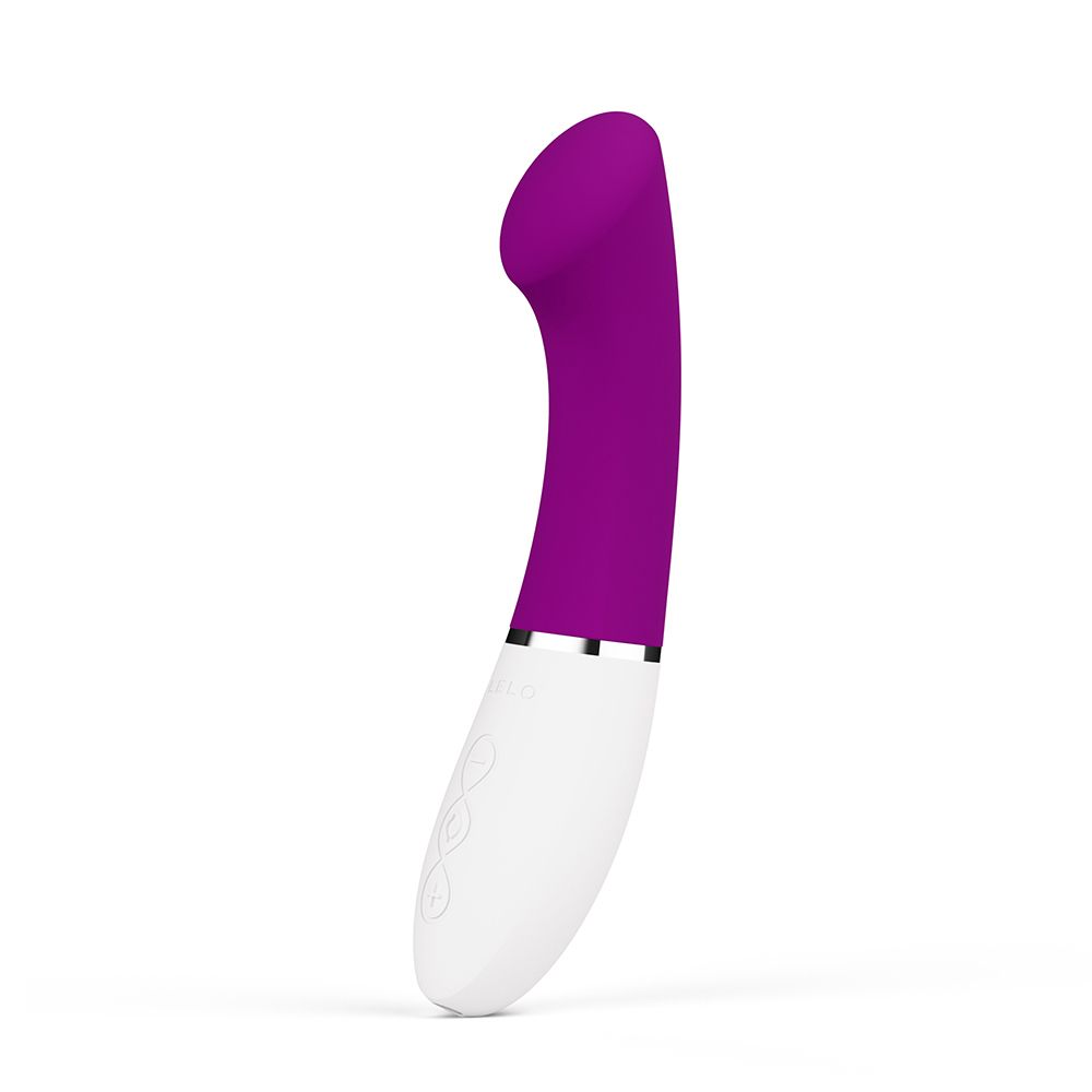 Weiß-lila Vibrator. Gebogene Form. Oberteil lila, Unterteil weiß. Silberfarbener Ring.