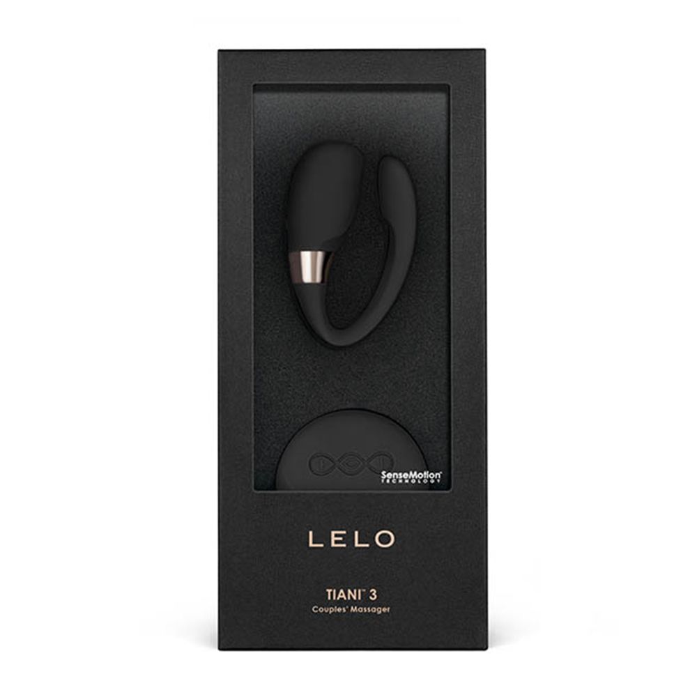 Schwarze Verpackung mit Sichtfenster. Enthält ein schwarzes U-förmiges Gerät und ein rundes Bedienelement. Text: LELO, TIANI 3.