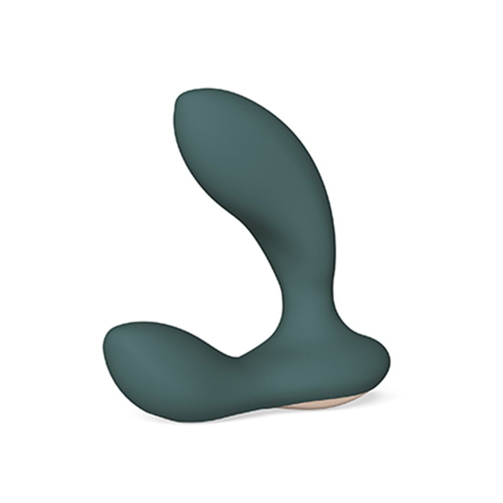 Grüner Vibrator. Geschwungene Form mit zwei Enden. Beige Basis. Glatte Oberfläche.