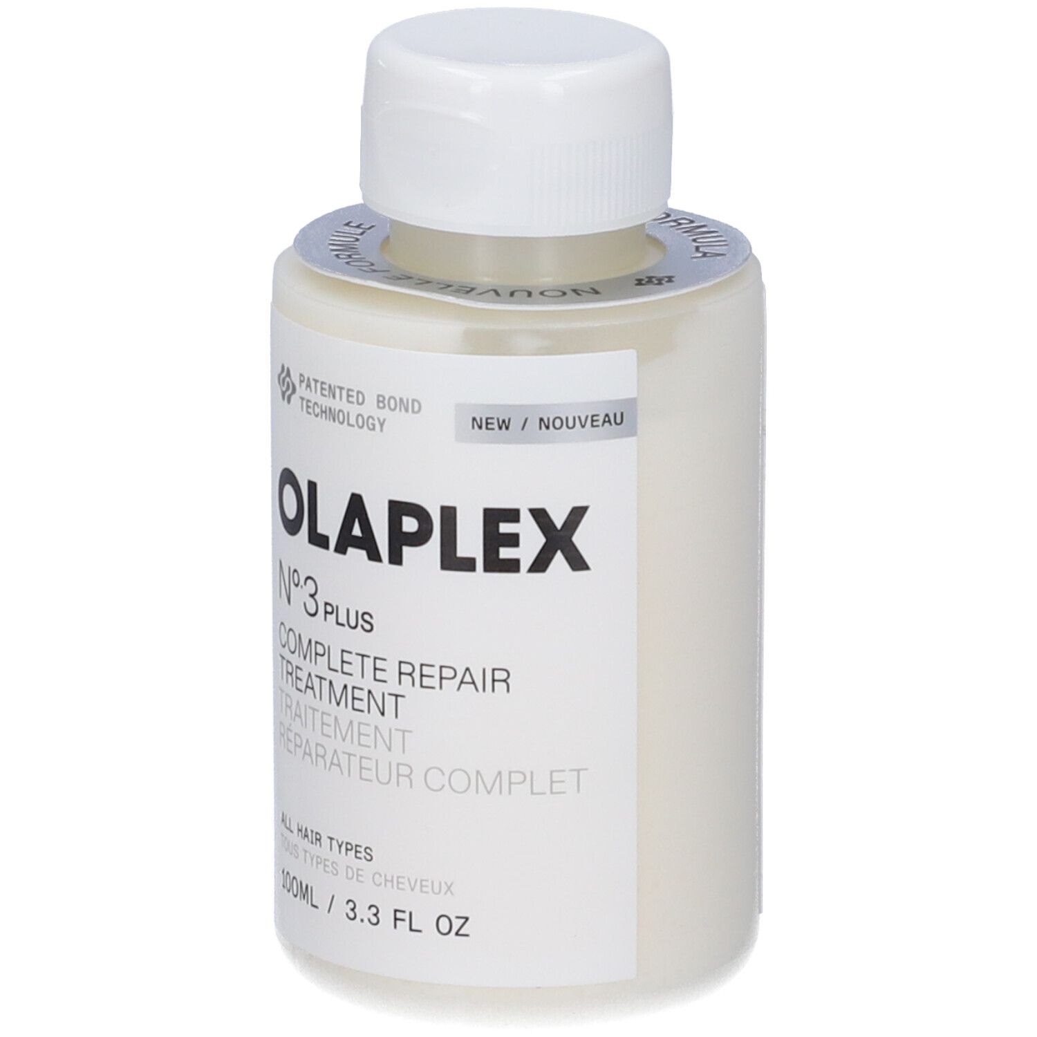 Beige Flasche mit weißem Deckel. Aufschrift: OLAPLEX N°3 PLUS COMPLETE REPAIR TREATMENT. Etikett mit Text und Logo.
