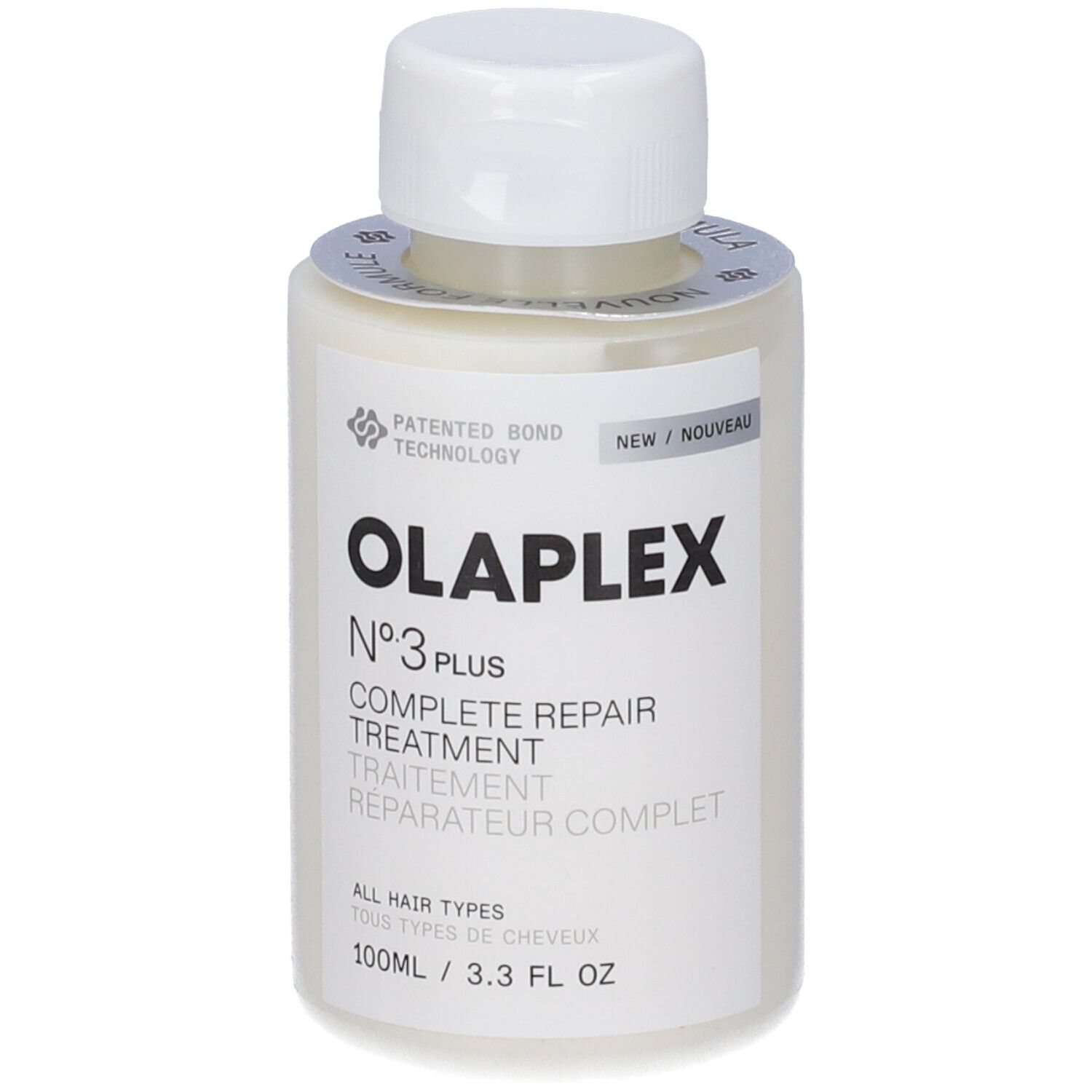 Beige Flasche mit weißem Deckel. Aufschrift: OLAPLEX N°3 PLUS COMPLETE REPAIR TREATMENT. Etikett mit Text und Logo.