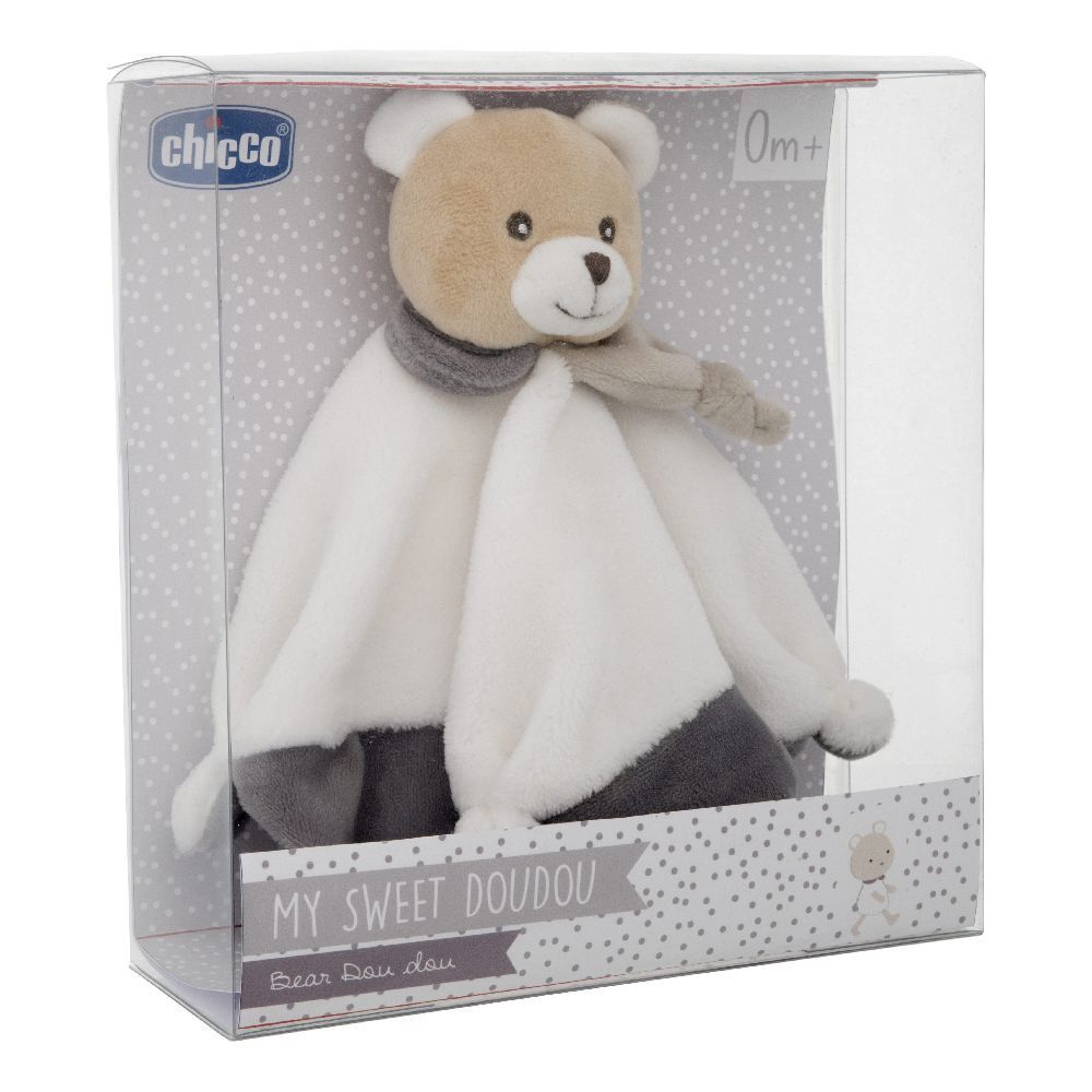 Chicco Dou Dou Orsetto in Verpackung. Beige-weißer Teddybär mit grauem Schal und Tuch. Verpackung mit Logo und Text.