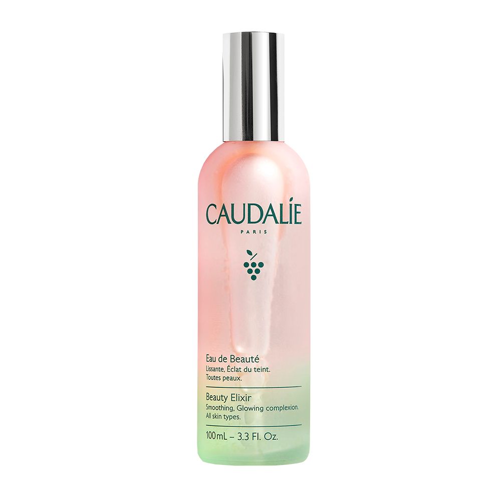 Flasche Caudalie Eau de Beauté mit Wassertropfen. Traube daneben. Text: Caudalie, Eau de Beauté, Beauty Elixir.