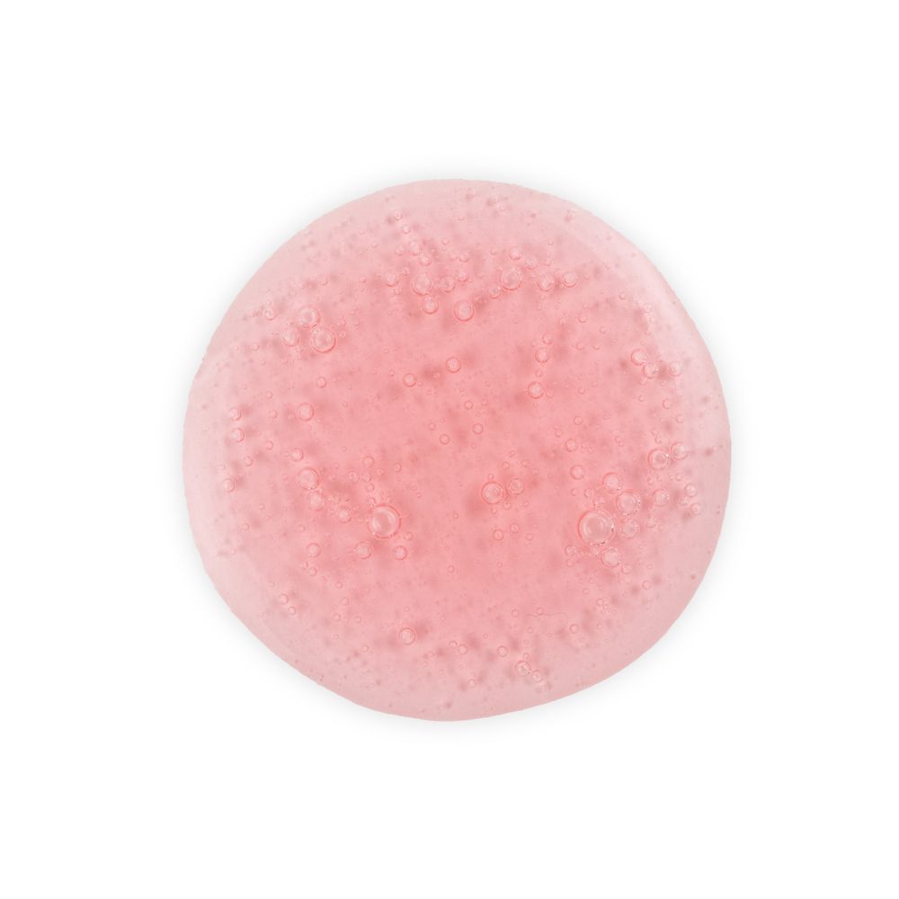 Runder, rosa Farbklecks mit Bläschen. Weißer Hintergrund.