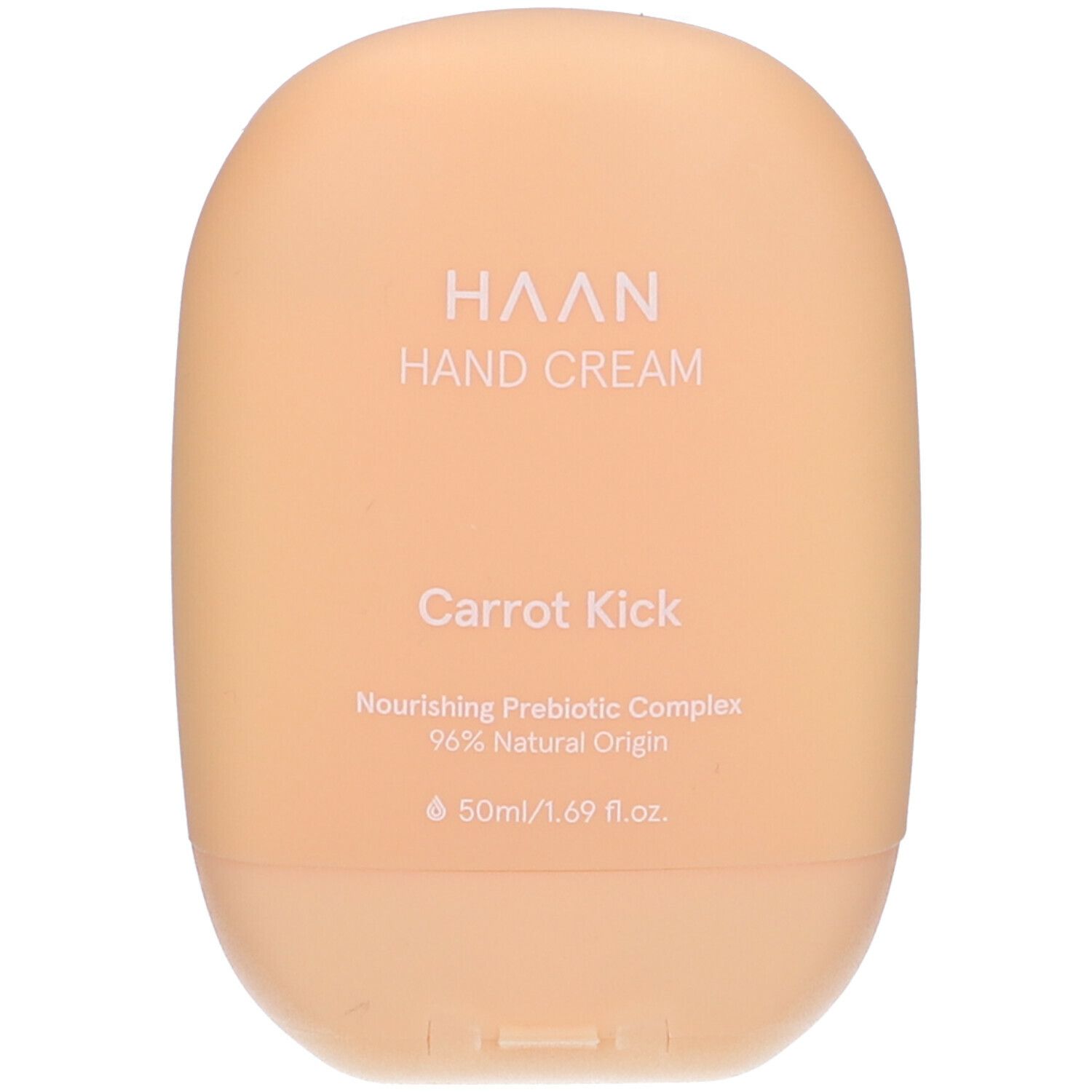 Beige Handcreme-Tube. Aufschrift: HAAN, Hand Cream, Carrot Kick. Enthält 96% natürliche Inhaltsstoffe.