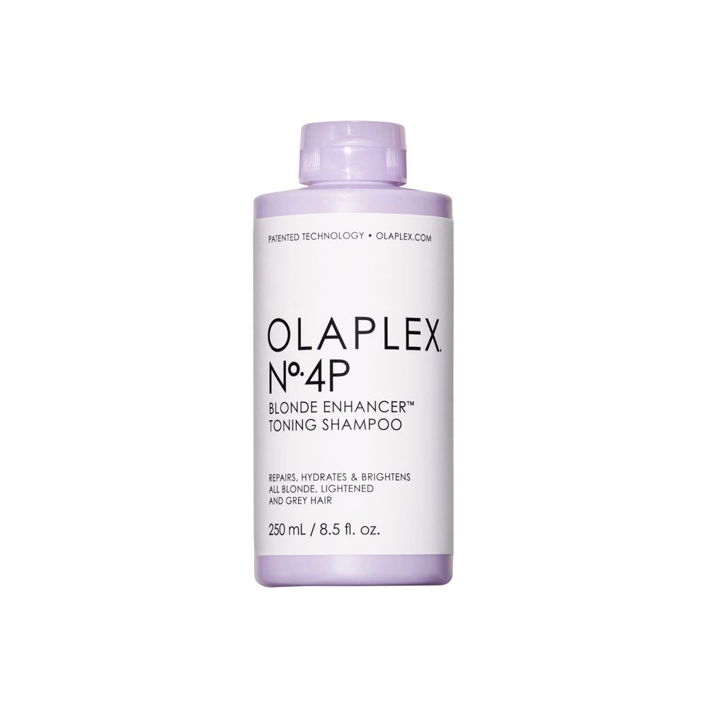 Flasche Olaplex Nº4P Blonde Enhancer Toning Shampoo. Weißes Etikett, lila Deckel und Flasche. Text: Blonde Enhancer Toning Shampoo.