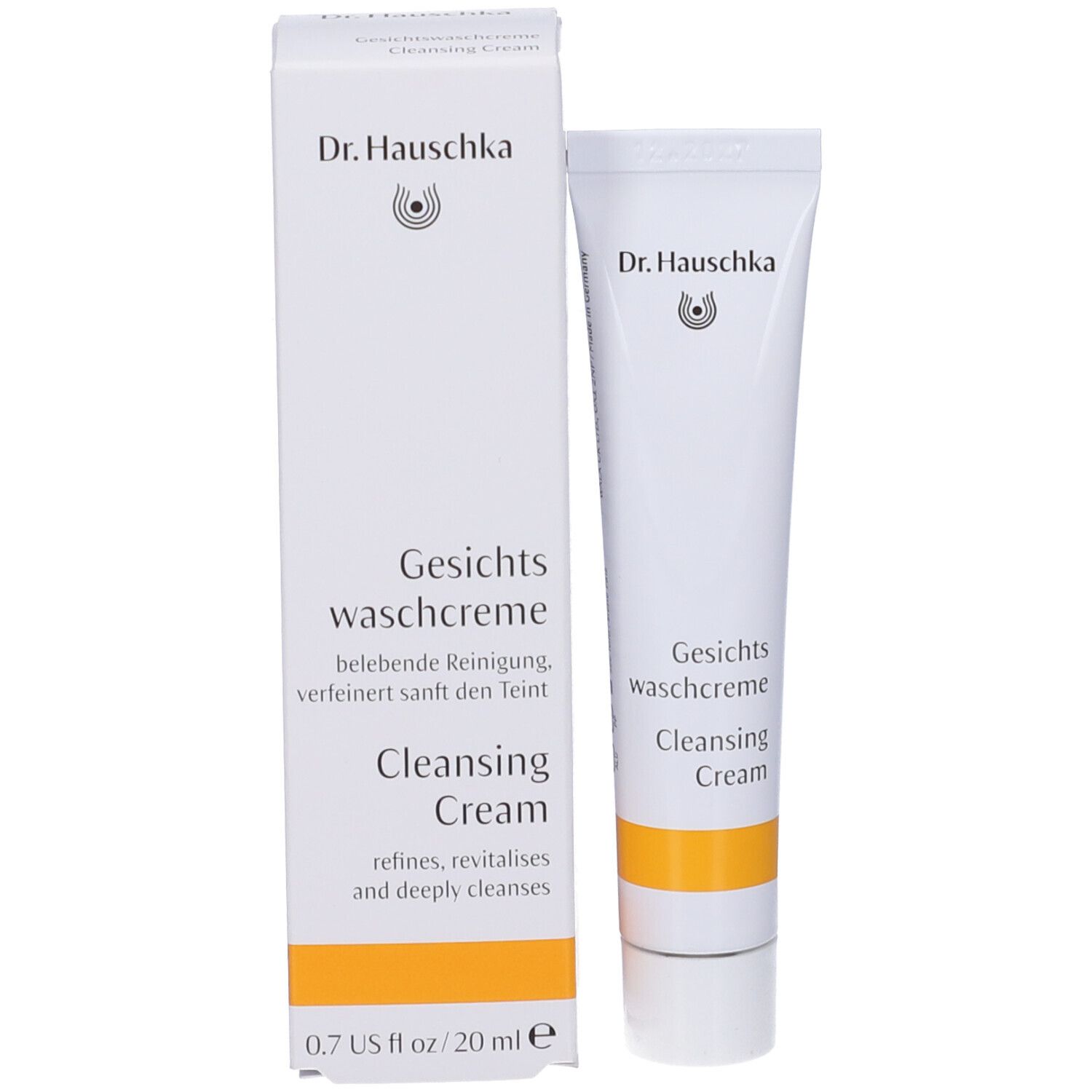 Dr. Hauschka Gesichts waschcreme in weißer Tube mit gelbem Streifen, 20 ml. Kartonverpackung daneben.