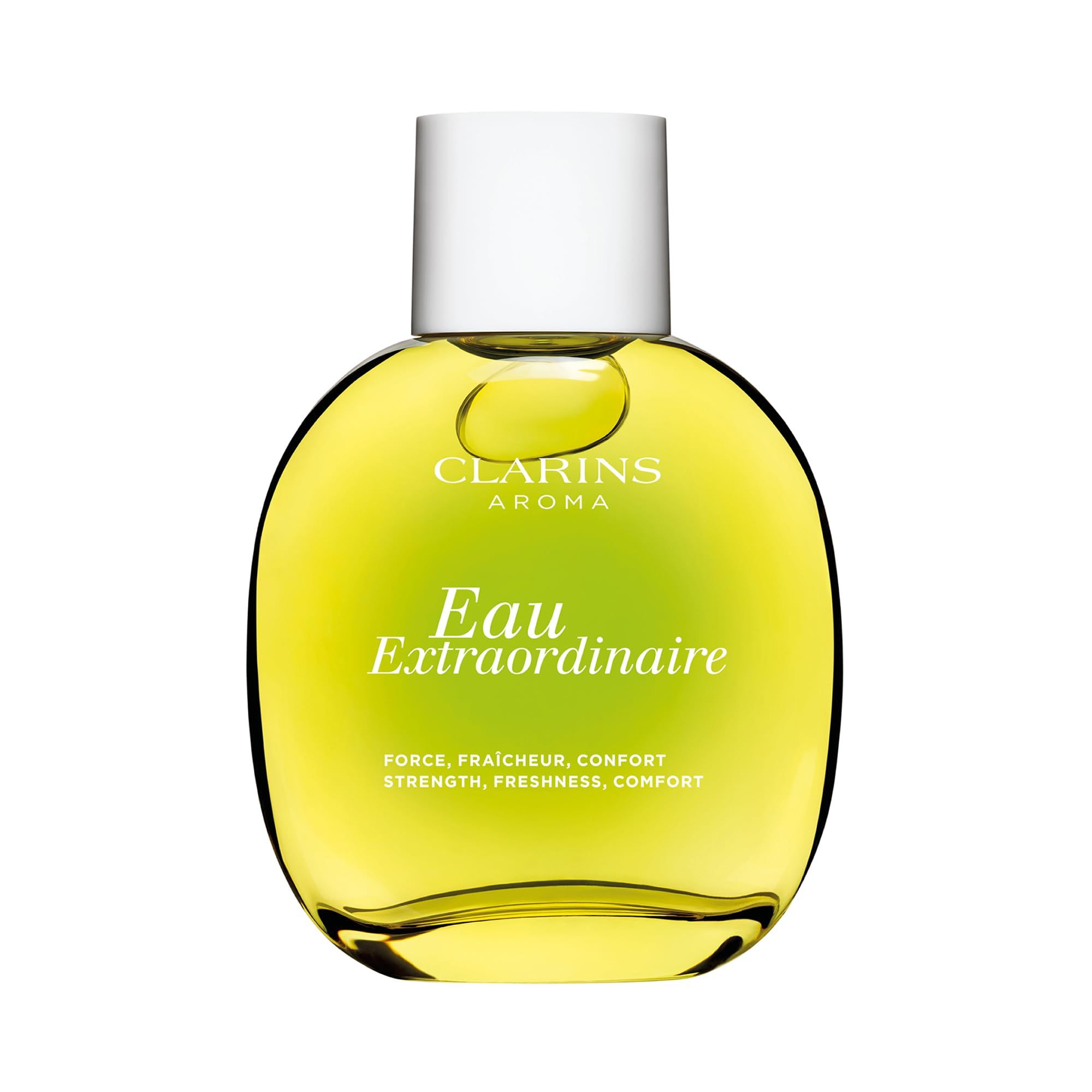 Runde Flasche mit gelber Flüssigkeit. Weißer Deckel. Schriftzug: Eau Extraordinaire, Clarins Aroma.