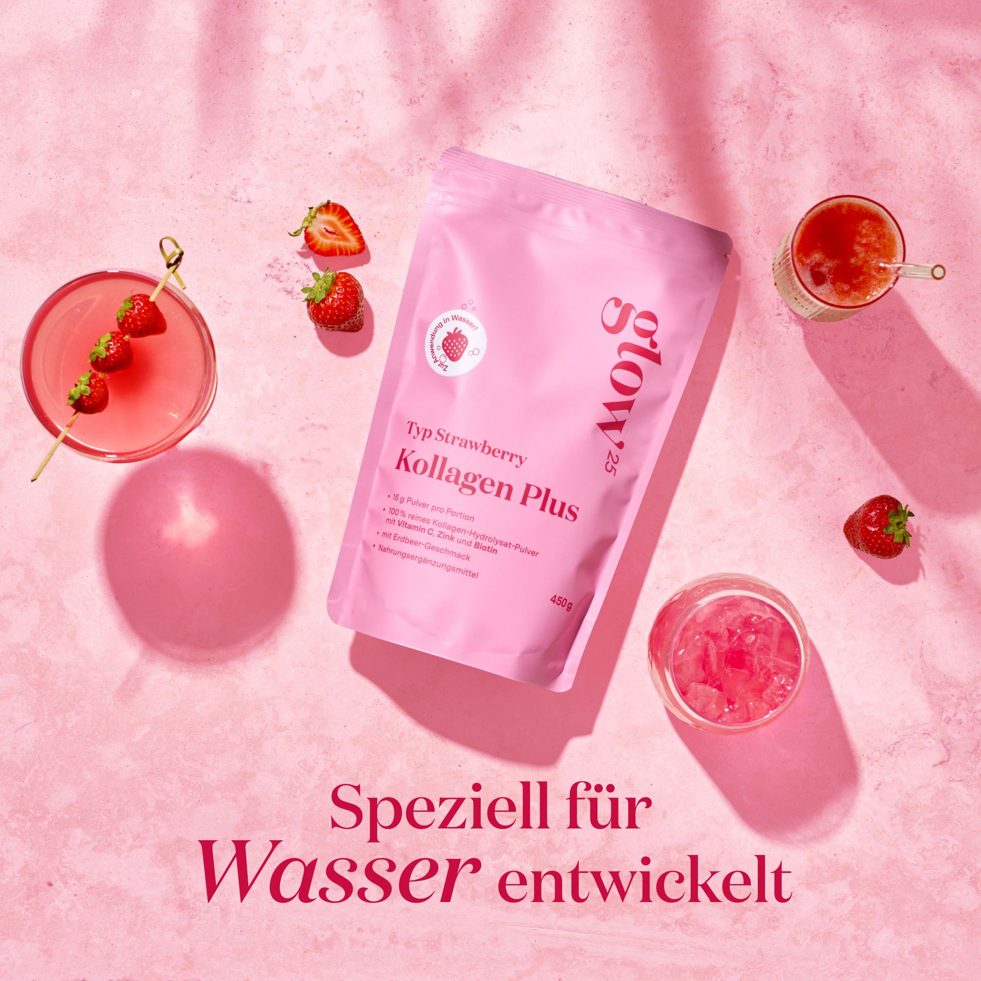 Produktverpackung, Erdbeeren, Getränke in Gläsern. Text: "Speziell für Wasser entwickelt". Rosa Hintergrund.
