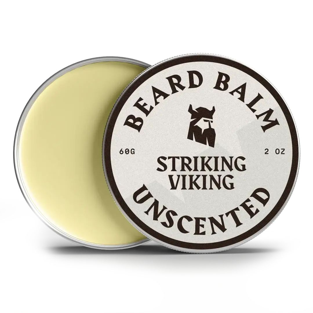 Runde Dose mit Bartbalsam. Deckel mit Aufschrift: BEARD BALM, STRIKING VIKING, UNSCENTED. Inhalt: 60g, 2 OZ. Offene Dose.