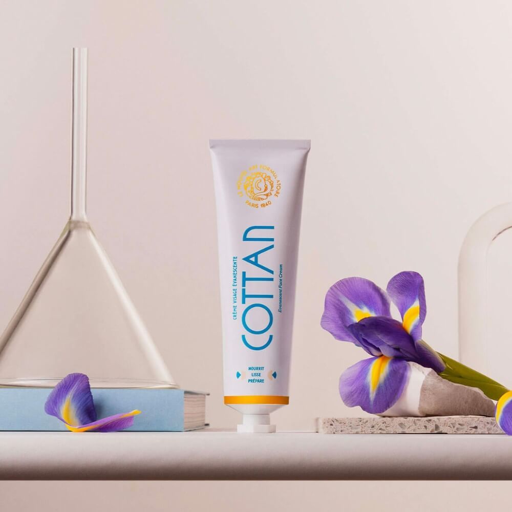 COTAN Creme-Tube. Irisblüte und Trichter. Buch und Stein.